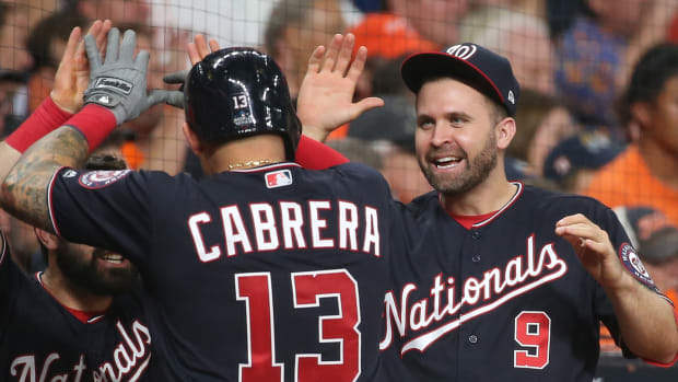 Nationals' Brian Dozier celebrates with Asdrubal Cabrera during the 2019 World Series